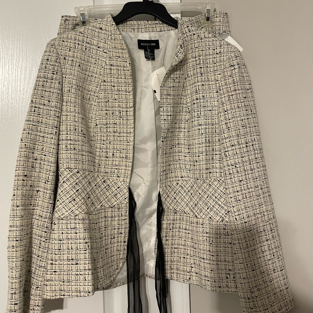 Brand New. Never worn. Two piece skirt set with tags.